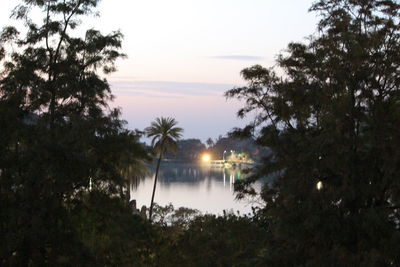 Scenic view of lake against sky at sunset