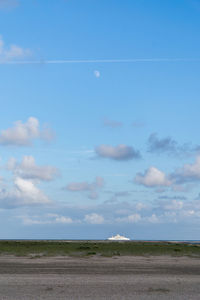 Scenic view of landscape against blue sky