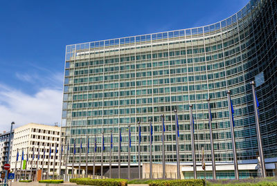 Low angle view of modern building against clear blue sky