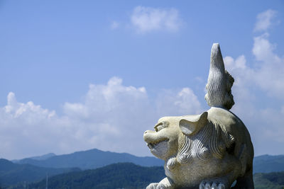 Close-up of statue against sky