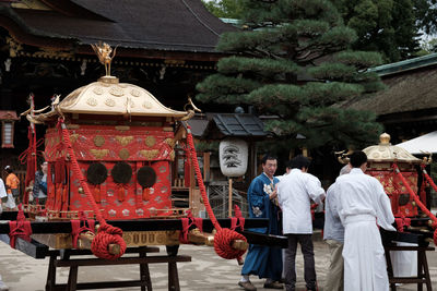 Man hanging outside temple