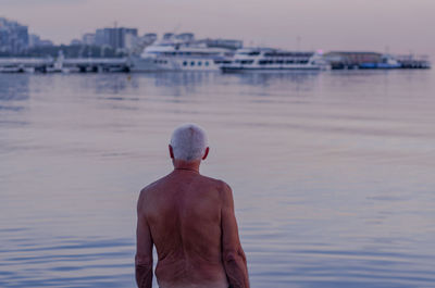 Rear view of man looking at sea