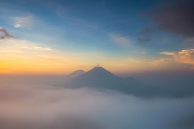 Scenic view of mountains against sky during sunset