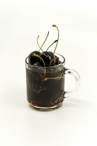 Close-up of beer glass against white background