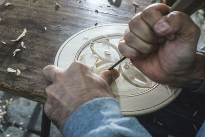 High angle view of man working on table