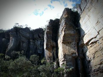 Low angle view of rock formation against sky