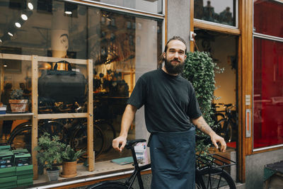 Portrait of man standing in store