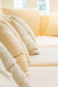 Close-up of cushions on sofa at home