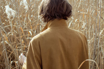 Rear view of man on field