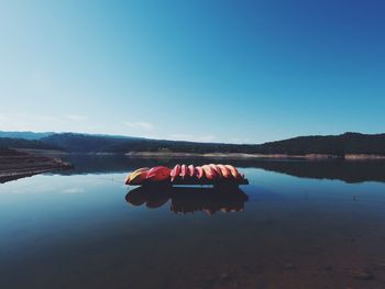 Ready kayaks on calm water