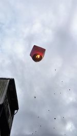 Low angle view of birds flying against sky