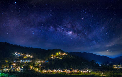 Scenic view of landscape against sky at night