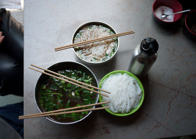 Directly above shot of food in bowls on marble