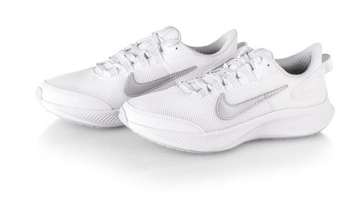 Close-up of shoes against white background