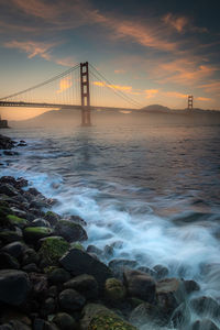 View of suspension bridge over sea