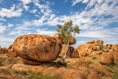 Rock formations on landscape against sky