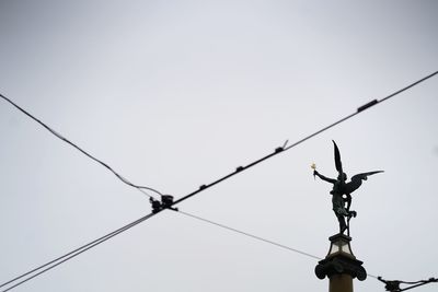 Low angle view of statue against sky