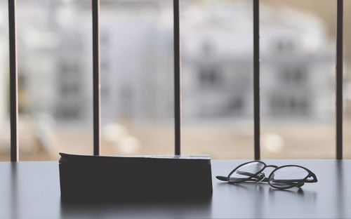 Close-up of eyeglasses on table