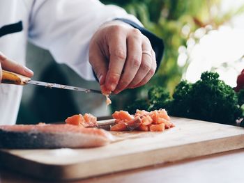 Close-up of chef preparing food