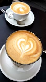 Close-up of cappuccino on table