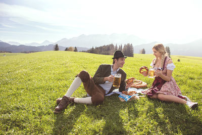 Woman sitting on field