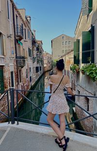 Side view of woman standing on street