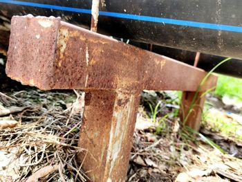 Close-up of old rusty bicycle on field