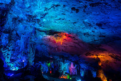 Low angle view of illuminated cave