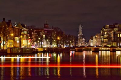 Illuminated buildings in city at night