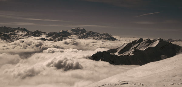 Scenic view of mountains against sky during winter