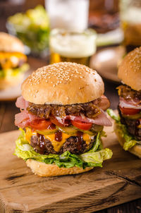 Close-up of burger on serving board at table