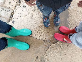 Low section of people standing on floor in city