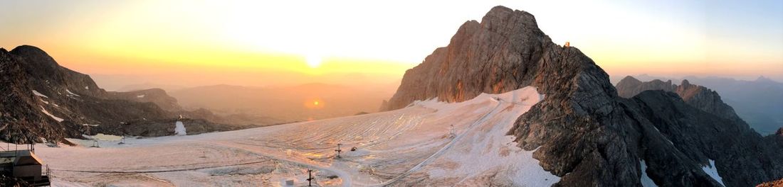 Scenic view of mountains against sky during sunset