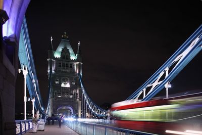 Low angle view of suspension bridge at night