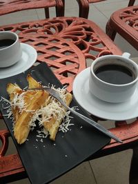 High angle view of coffee served on table