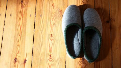 High angle view of shoes on hardwood floor