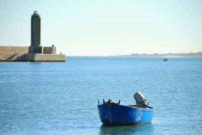 Boat in sea against clear sky