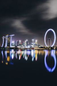 Reflection of illuminated buildings in water