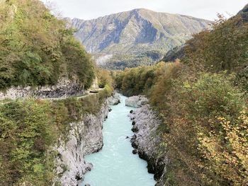 Scenic view of river amidst mountains