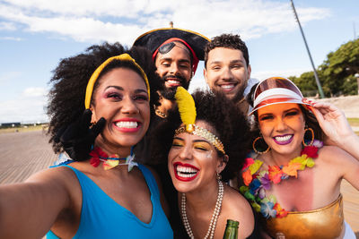 Portrait of happy friends with make up