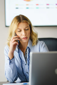 Young woman using mobile phone