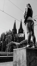 View of woman in front of building