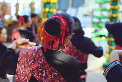 Rear view of woman dancing during traditional festival