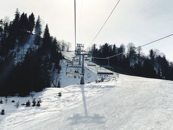 Snow covered landscape against sky