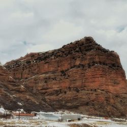 Low angle view of rock formation against sky