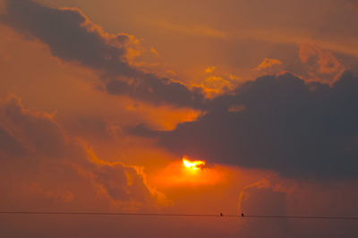 Low angle view of dramatic sky during sunset