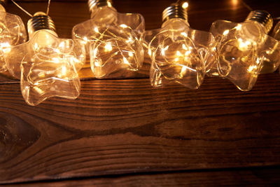 High angle view of illuminated lights on table