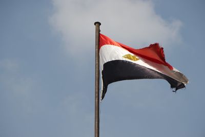 Low angle view of flag against sky