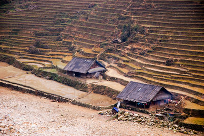 High angle view of houses on field