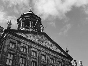 Low angle view of historical building against cloudy sky